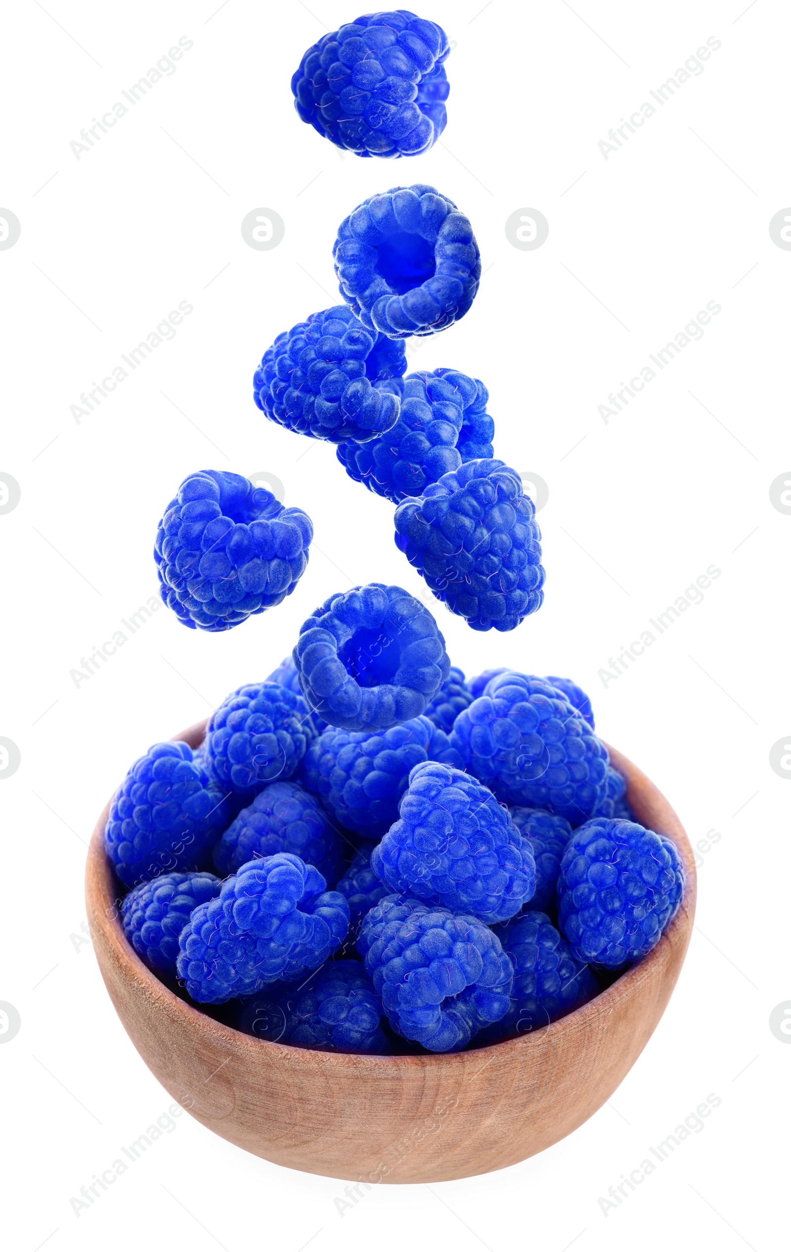 Image of Fresh blue raspberries falling into bowl on white background