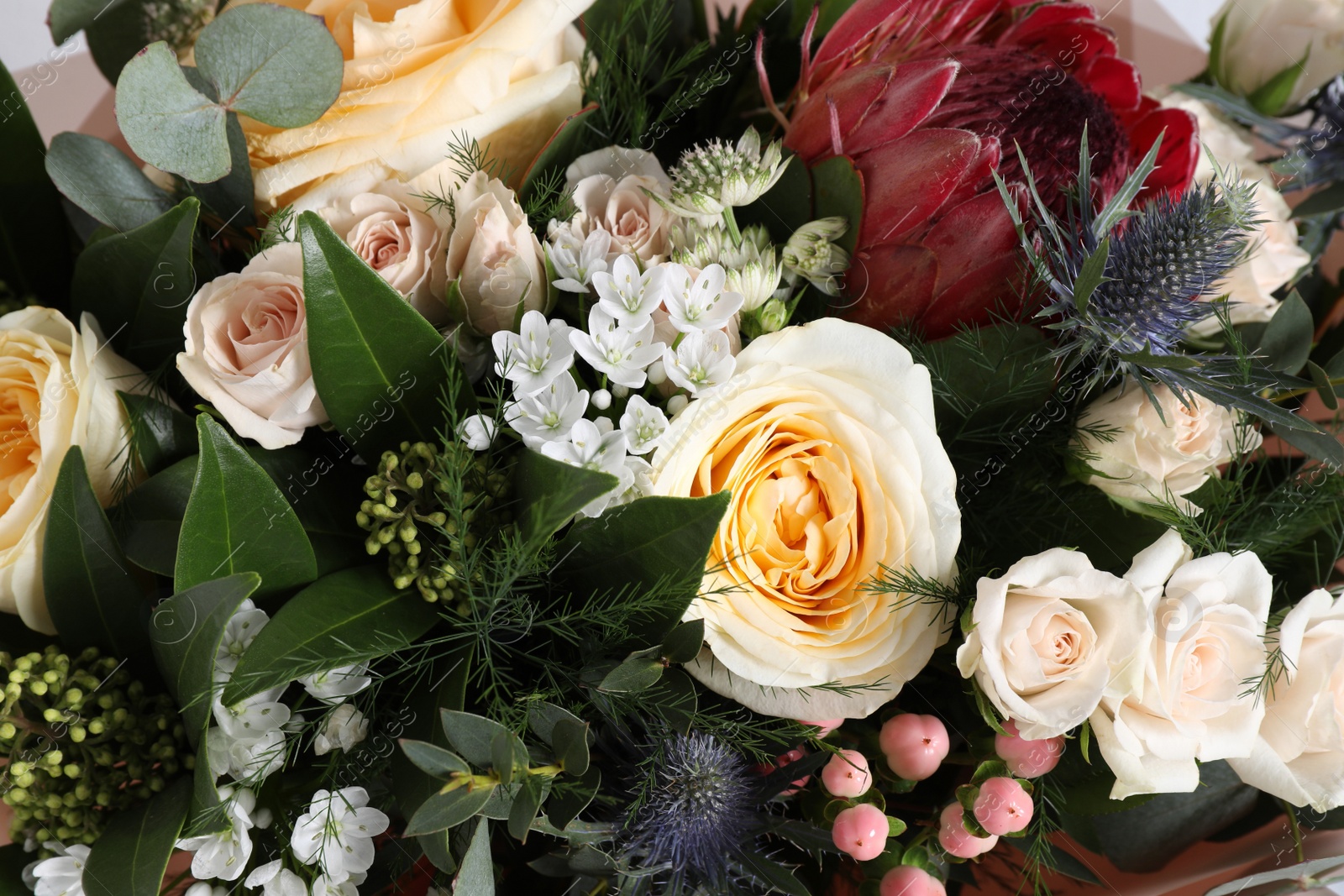 Photo of Beautiful bouquet with roses as background, closeup