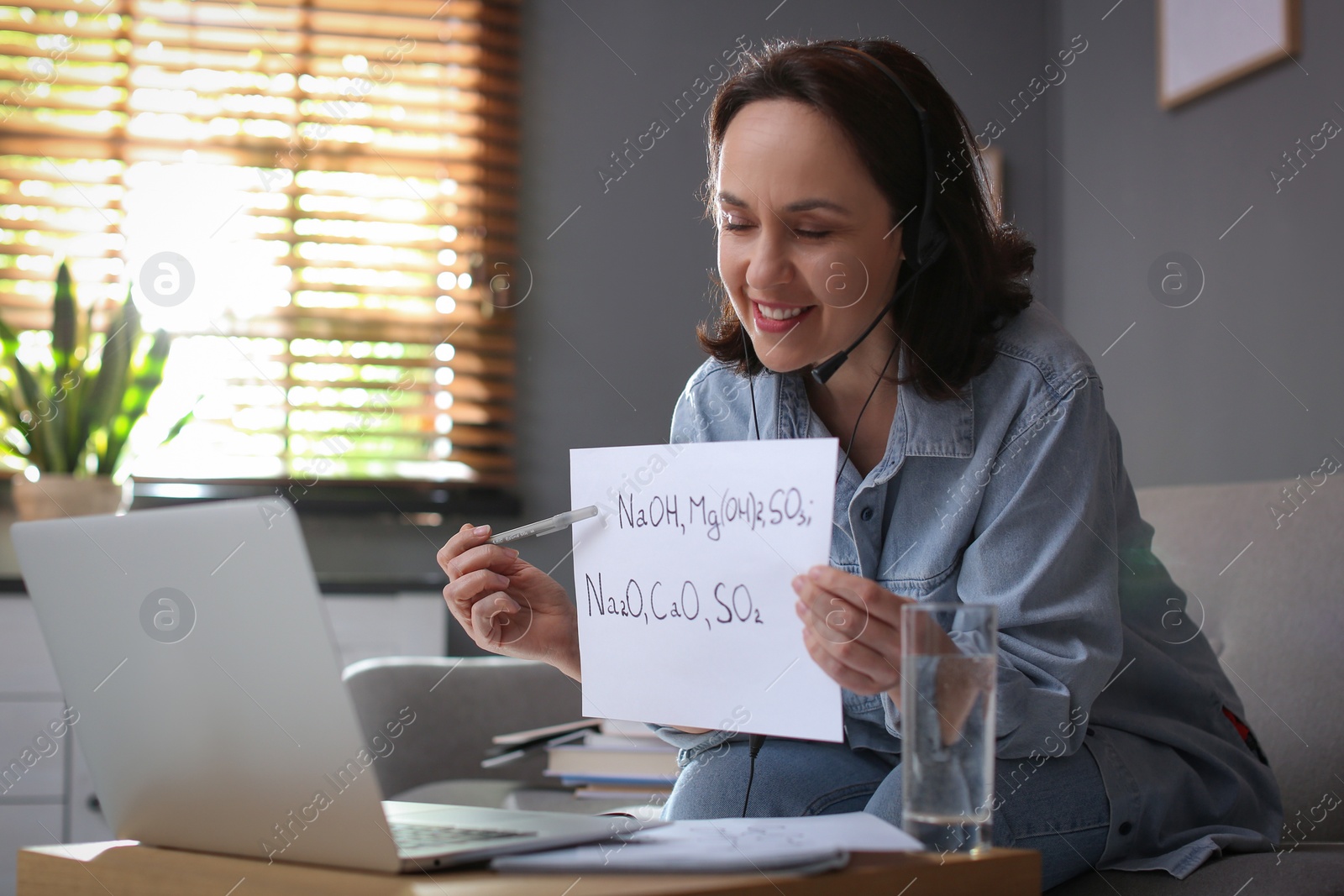 Photo of Teacher conducting online lesson at home during COVID-19 quarantine