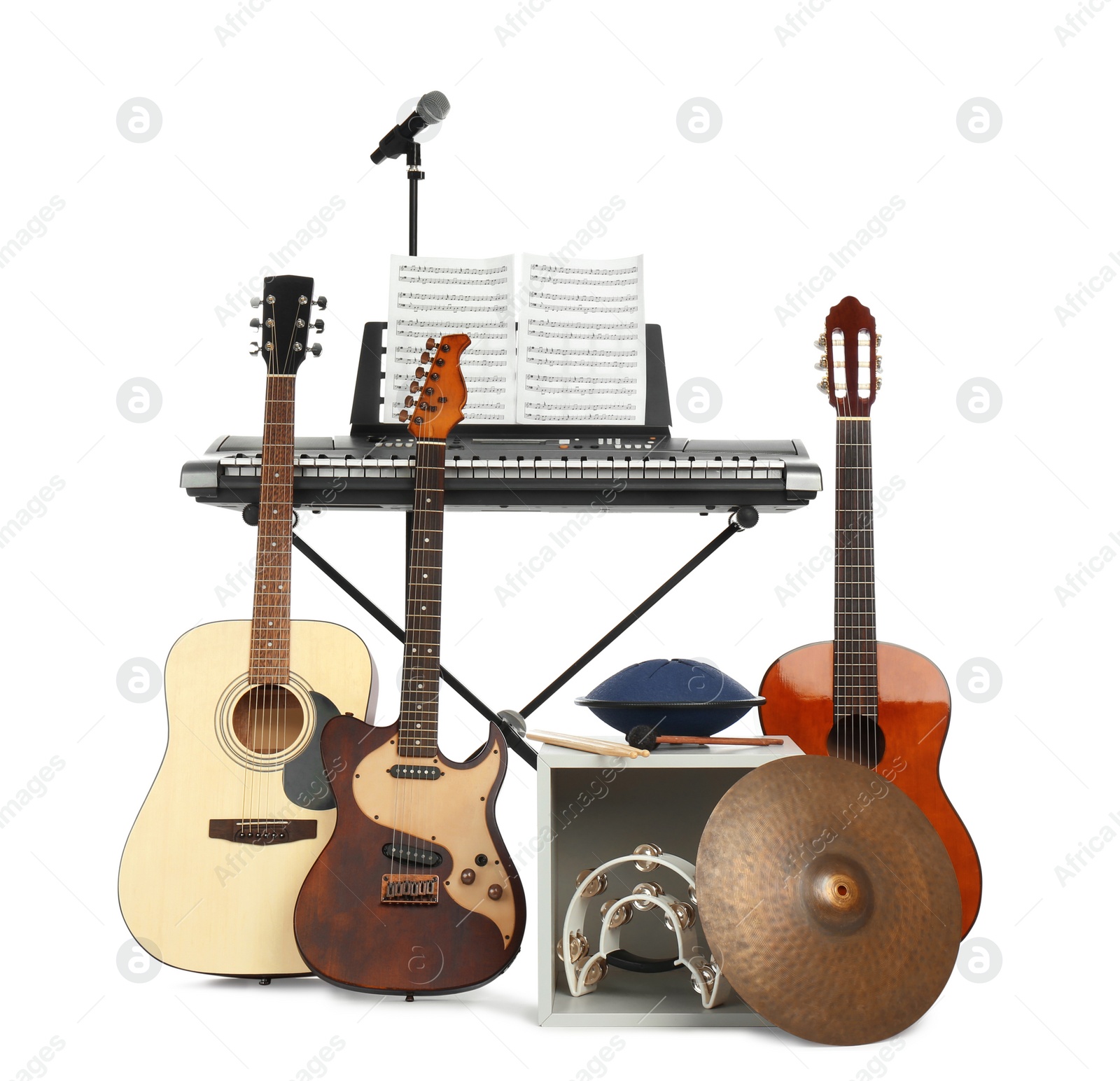 Photo of Set of different musical instruments and microphone 
on white background