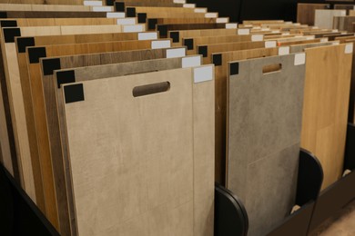 Photo of Many different samples of wooden flooring in store