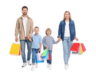 Photo of Family shopping. Happy parents and children with many colorful bags on white background
