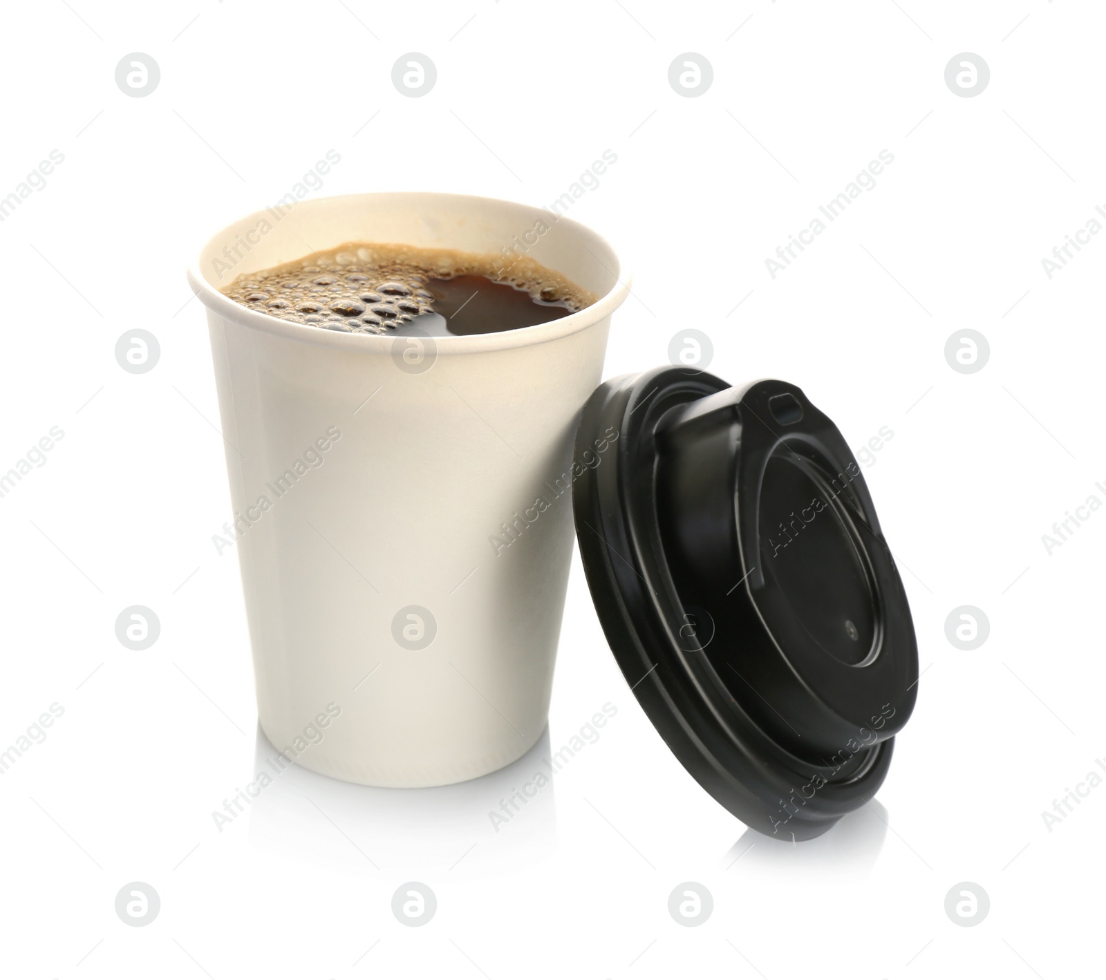 Photo of Aromatic coffee in takeaway paper cup and lid on white background. Space for design