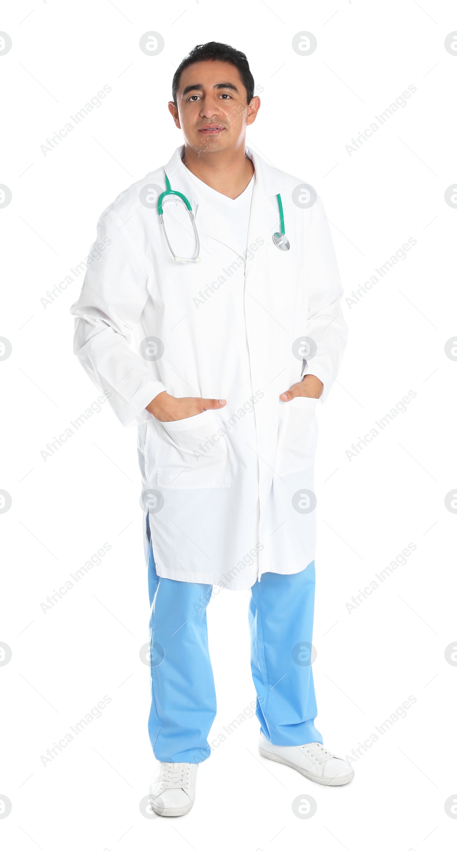 Photo of Full length portrait of male Hispanic doctor isolated on white. Medical staff