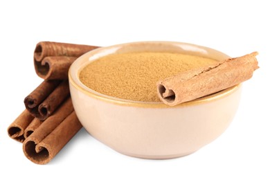 Photo of Dry aromatic cinnamon sticks and powder isolated on white