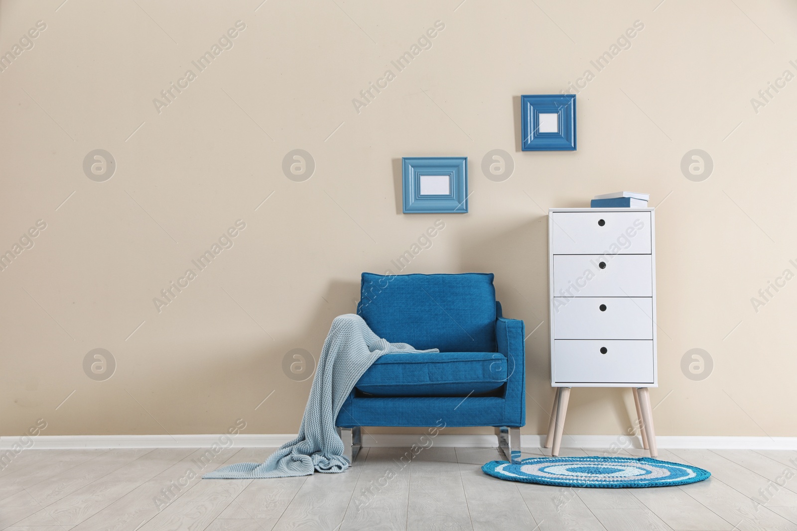 Photo of Chest of drawers in stylish living room interior