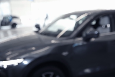 Blurred view of automobile at professional car wash service