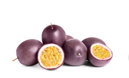 Photo of Cut and whole passion fruits on white background