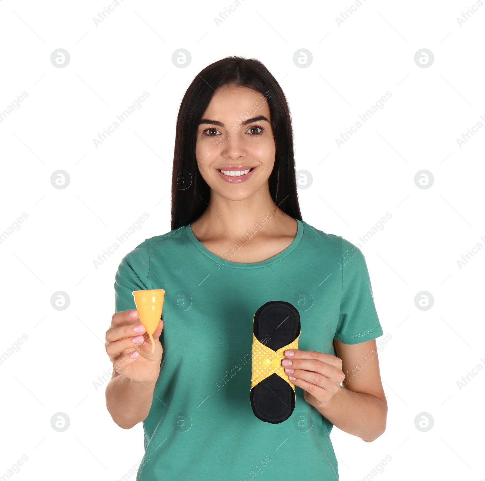 Photo of Young woman with menstrual cup and reusable pad on white background