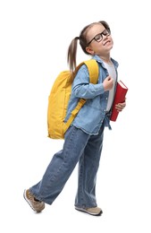 Photo of Cute little girl in glasses with book and backpack on white background