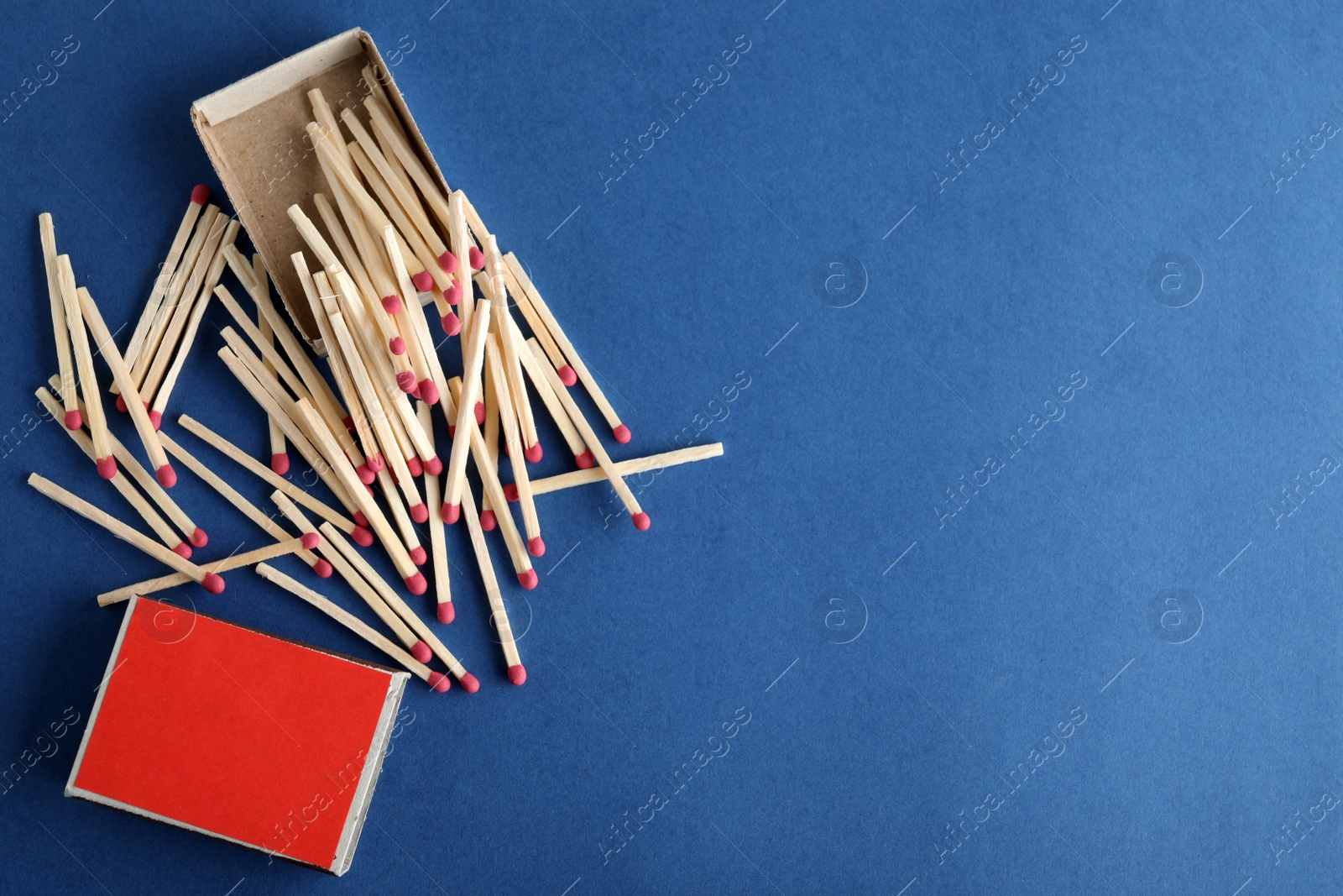 Photo of Flat lay composition with matches and space for text on color background