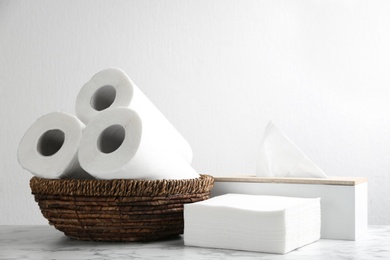 Photo of Clean paper tissues on white marble table