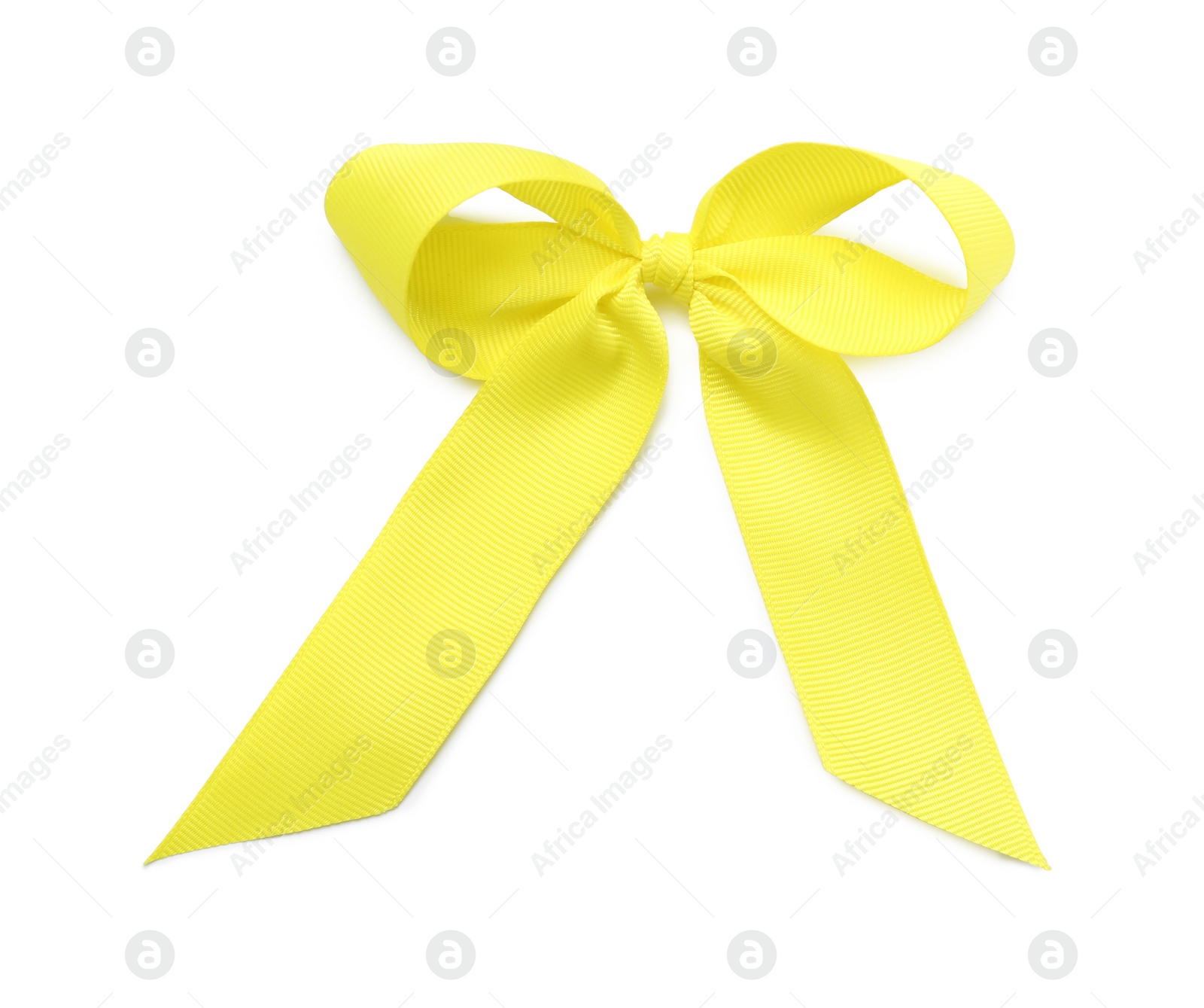 Photo of Yellow ribbon bow on white background, top view