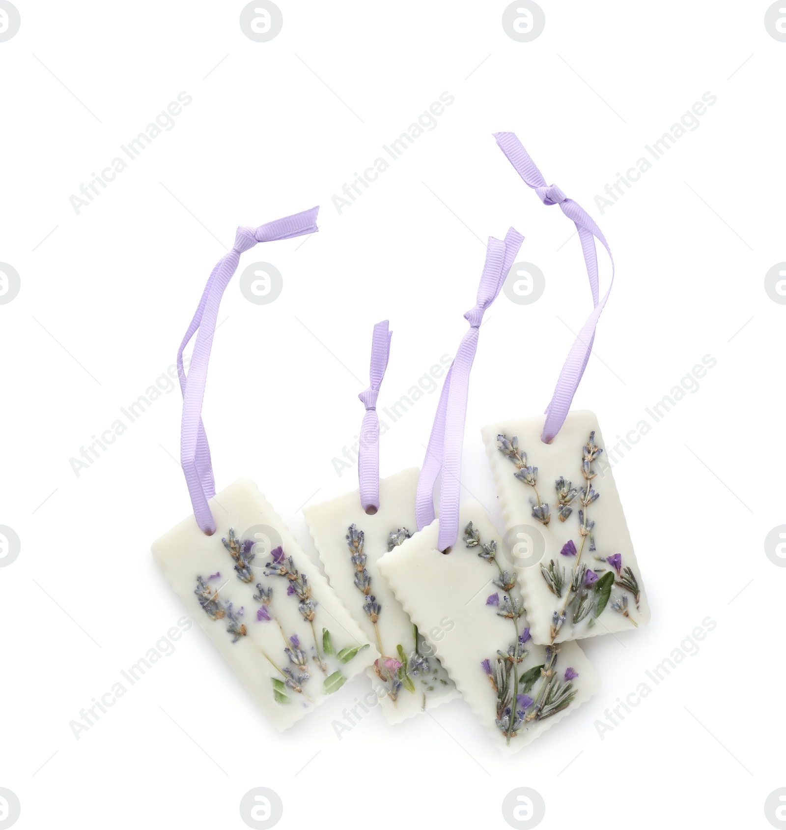 Photo of Beautiful scented sachets with flowers on white background, top view