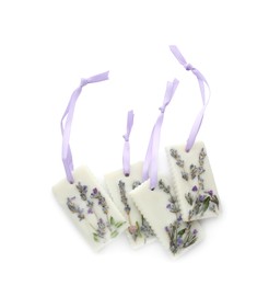 Beautiful scented sachets with flowers on white background, top view