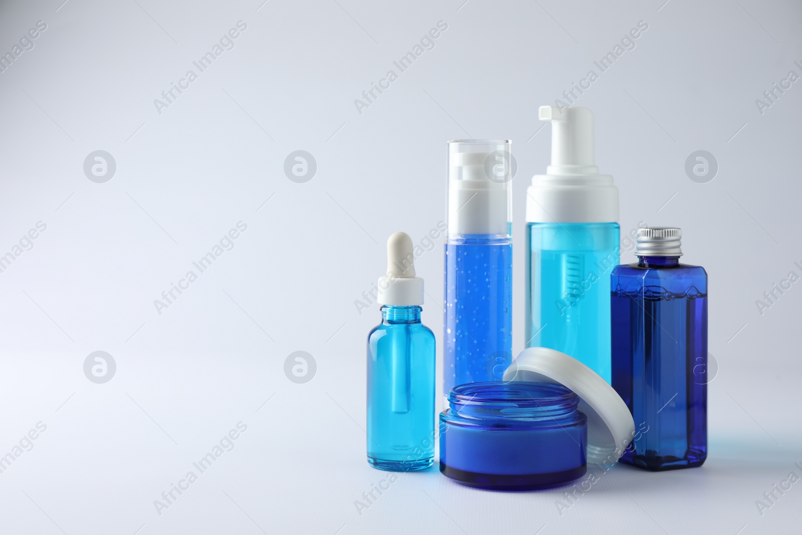 Photo of Set of luxury cosmetic products on white background. Space for text