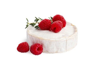 Photo of Brie cheese served with raspberries isolated on white