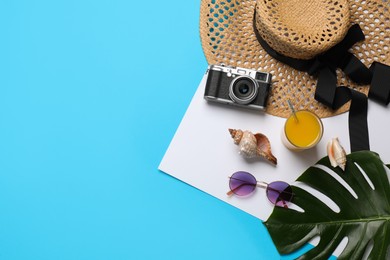 Flat lay composition with different beach objects on color background, space for text