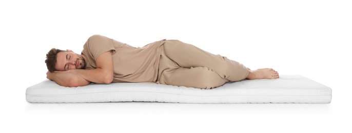Man sleeping on soft mattress against white background