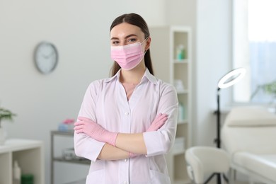 Photo of Cosmetologist in medical uniform in modern clinic