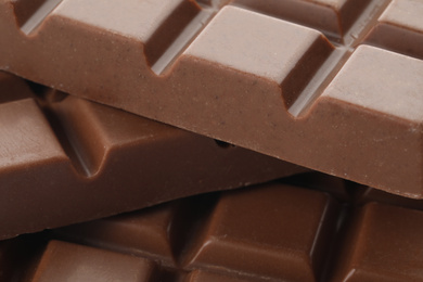 Photo of Delicious milk chocolate as background, closeup view