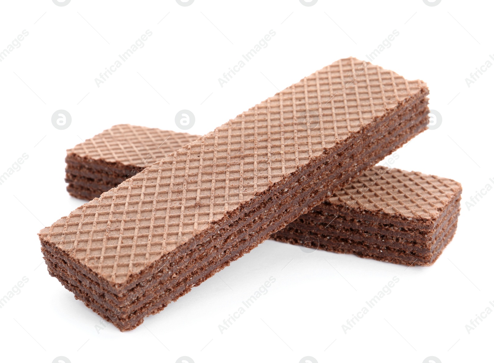 Photo of Delicious crispy wafers on white background. Sweet food