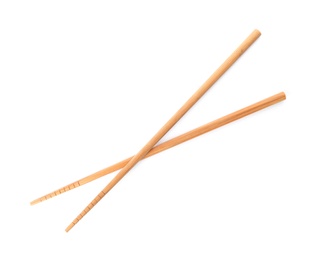 Photo of Chopsticks made of bamboo on white background, top view