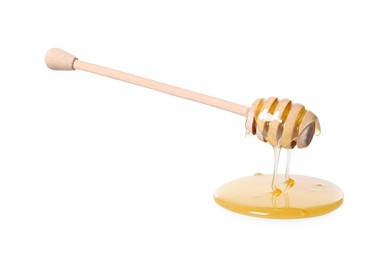 Natural honey dripping from dipper on white background