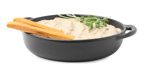 Photo of Delicious hummus with grissini sticks on white background