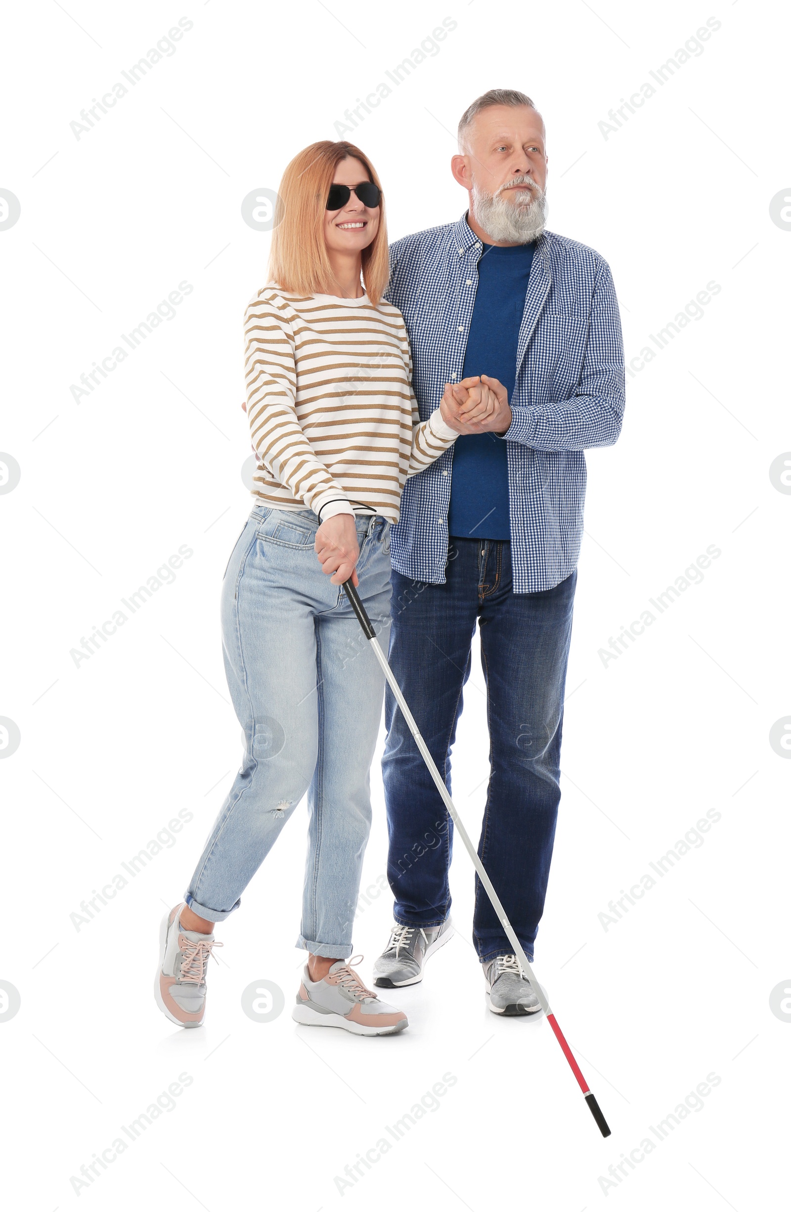 Photo of Mature man helping blind person with long cane on white background