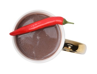 Cup of hot chocolate with chili pepper on white background, top view