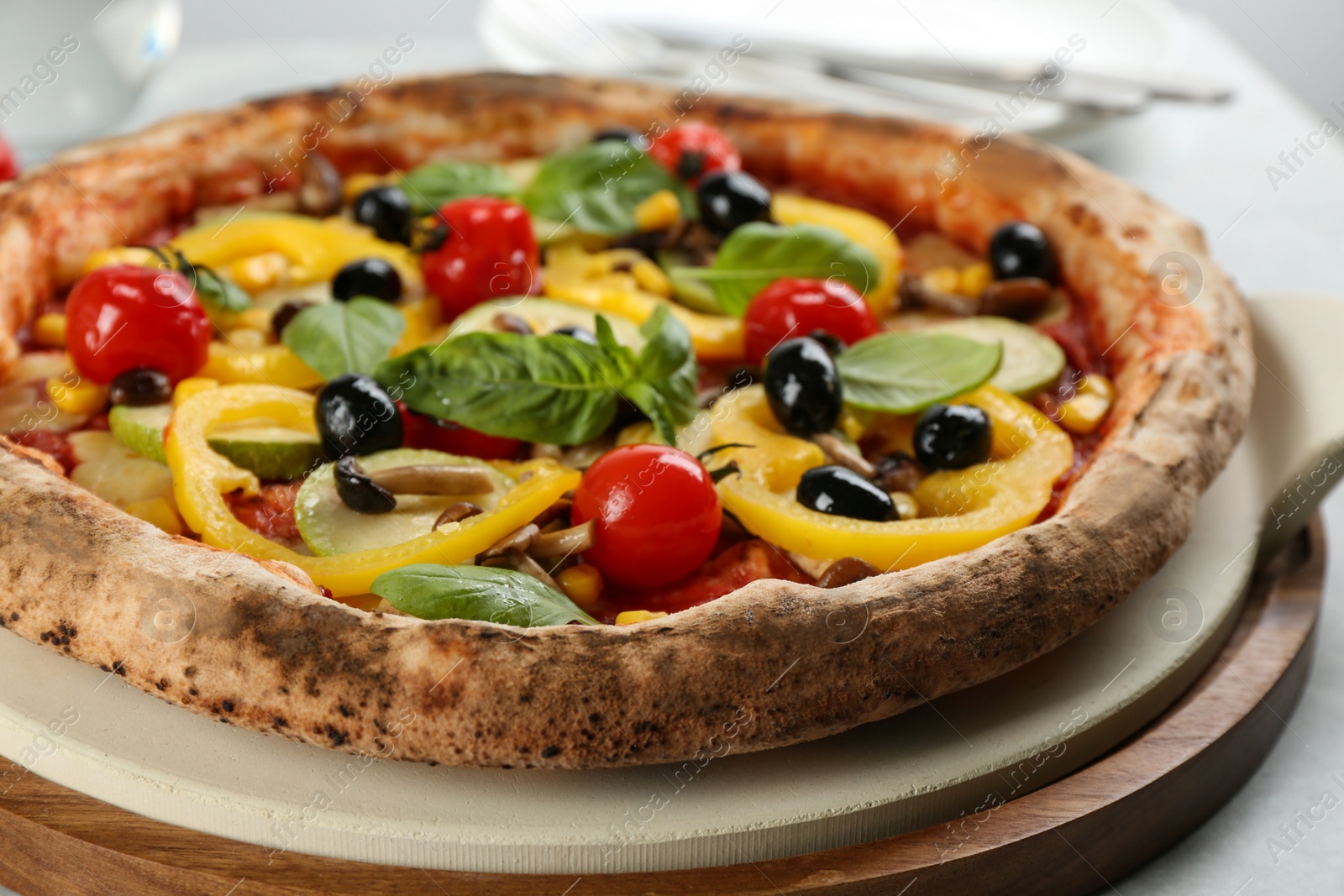 Photo of Tasty fresh vegetable pizza on table, closeup