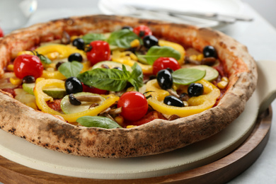 Photo of Tasty fresh vegetable pizza on table, closeup