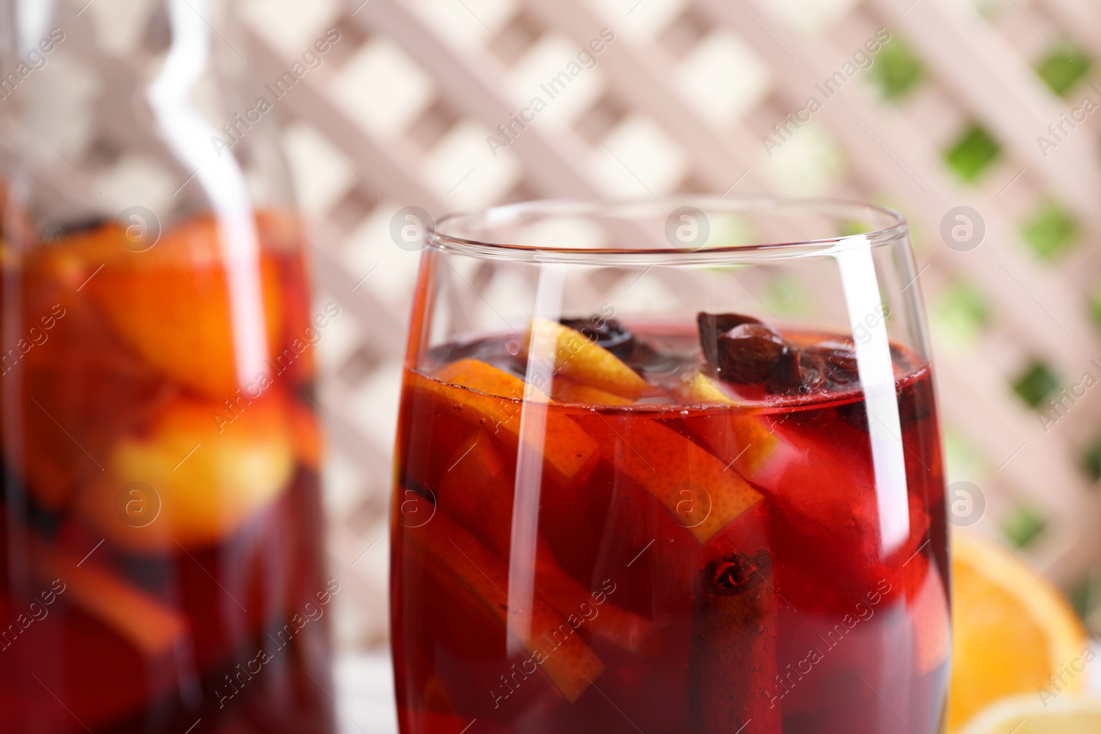 Photo of Aromatic punch drink in glass, closeup view