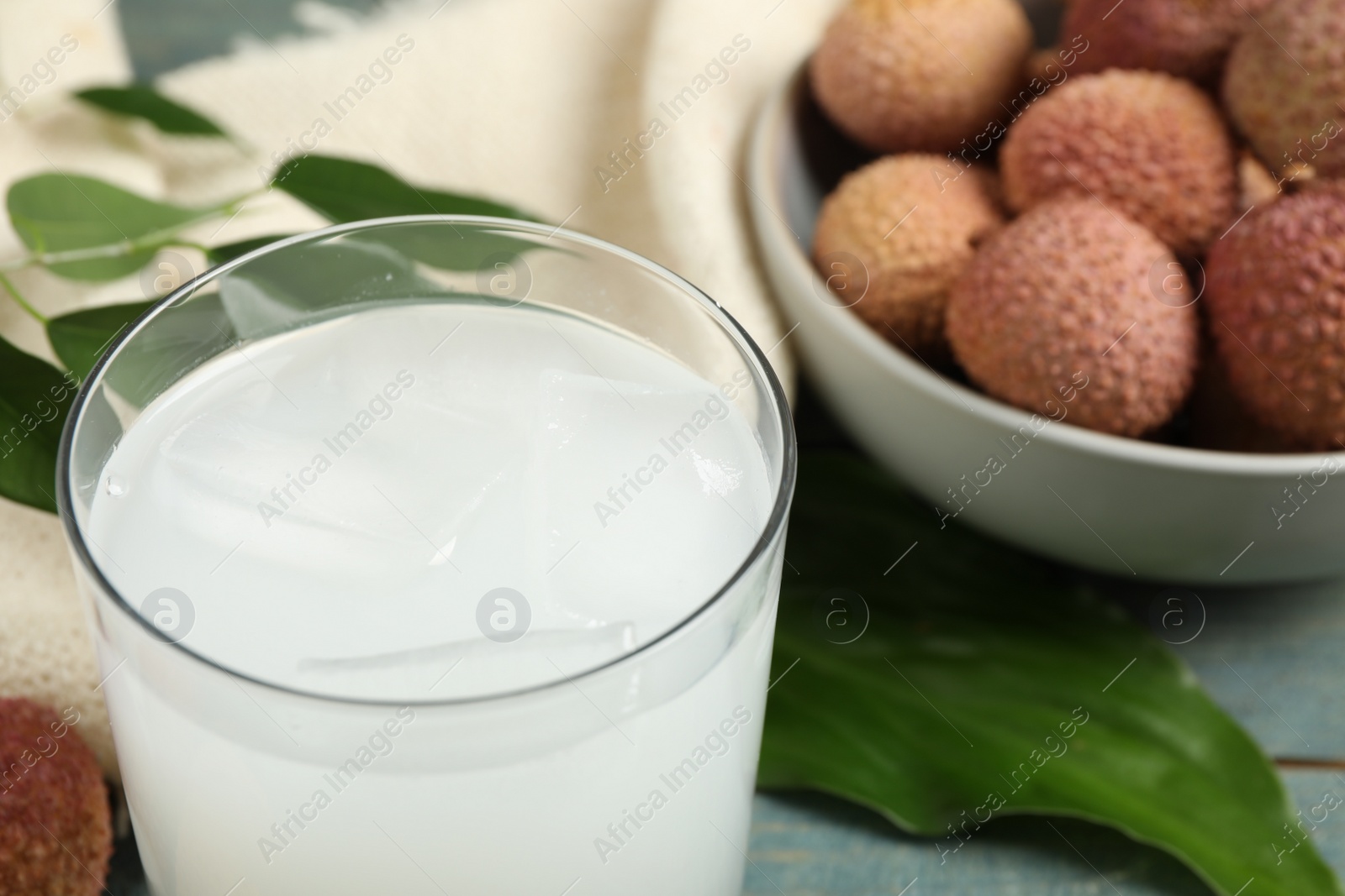 Photo of Freshly made lychee juice on table, closeup