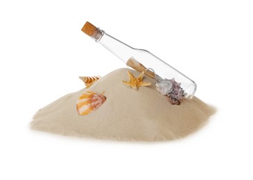 Photo of Corked glass bottle with rolled paper note and seashells on sand against white background