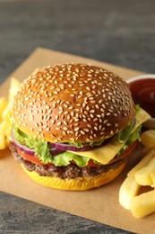 Photo of Burger with delicious patty and french fries on table, closeup