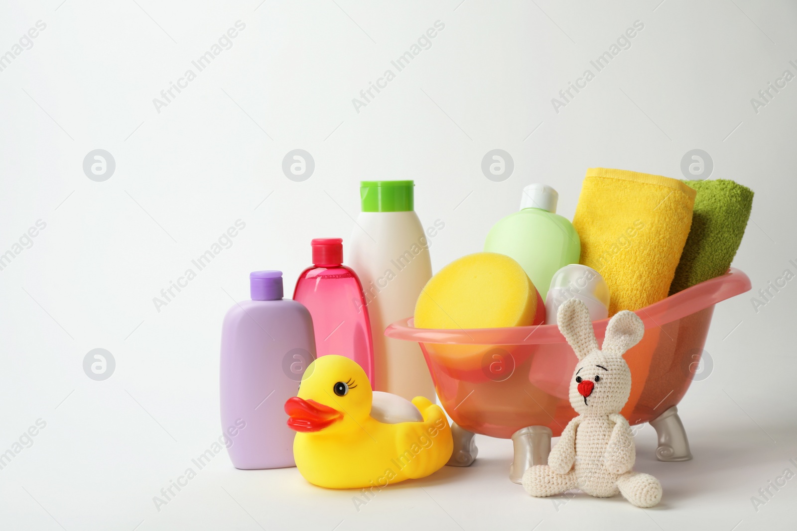 Photo of Baby bathing accessories, cosmetic products and toys on white background