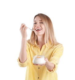 Photo of Young attractive woman eating tasty yogurt on white background