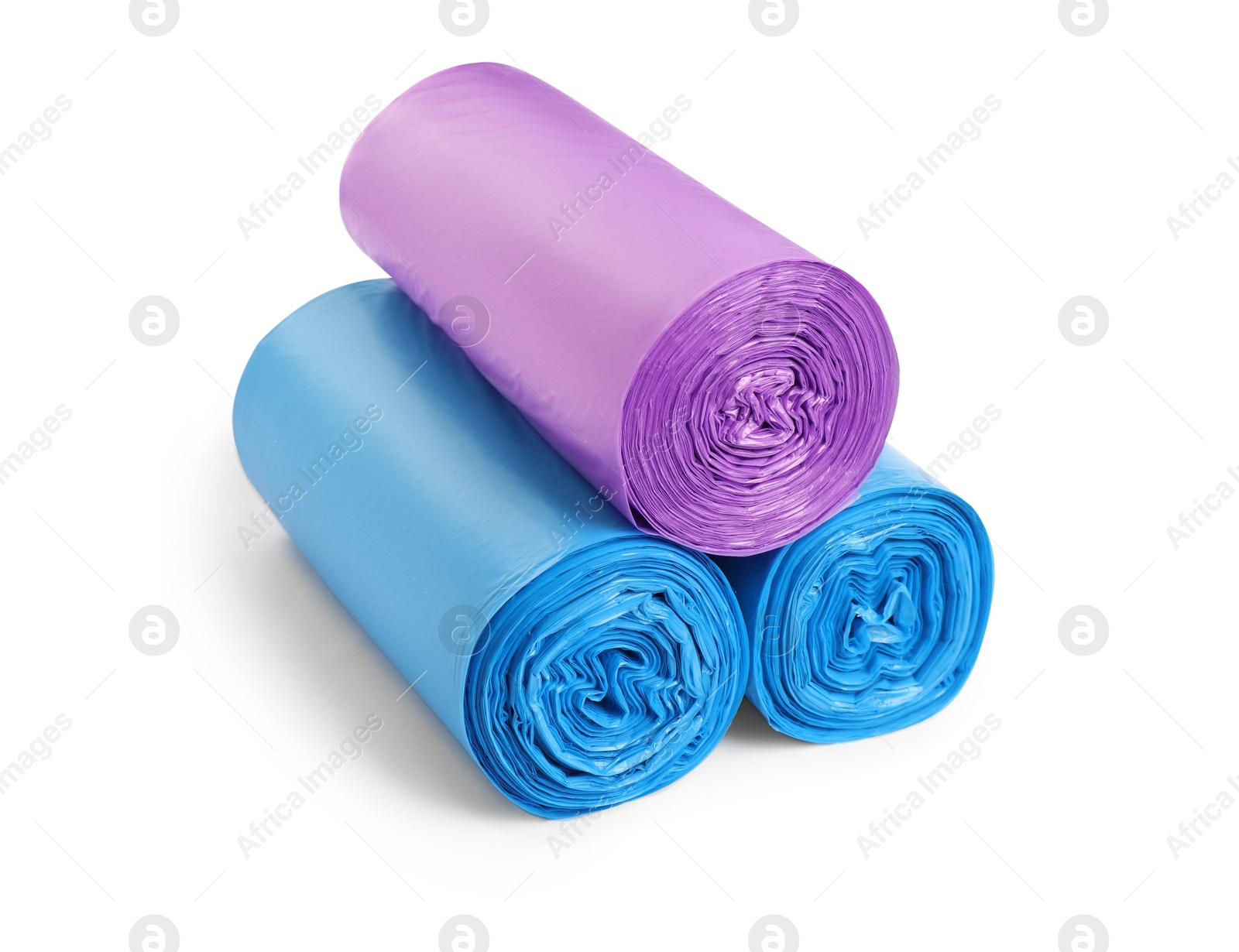 Photo of Rolls of different garbage bags on white background. Cleaning supplies