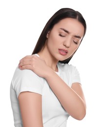 Photo of Young woman suffering from pain in shoulder on white background. Arthritis symptoms