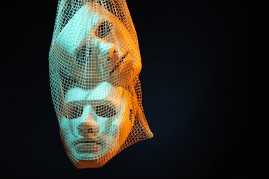 Photo of Net bag with plastic face masks on black background, space for text. Theatrical performance