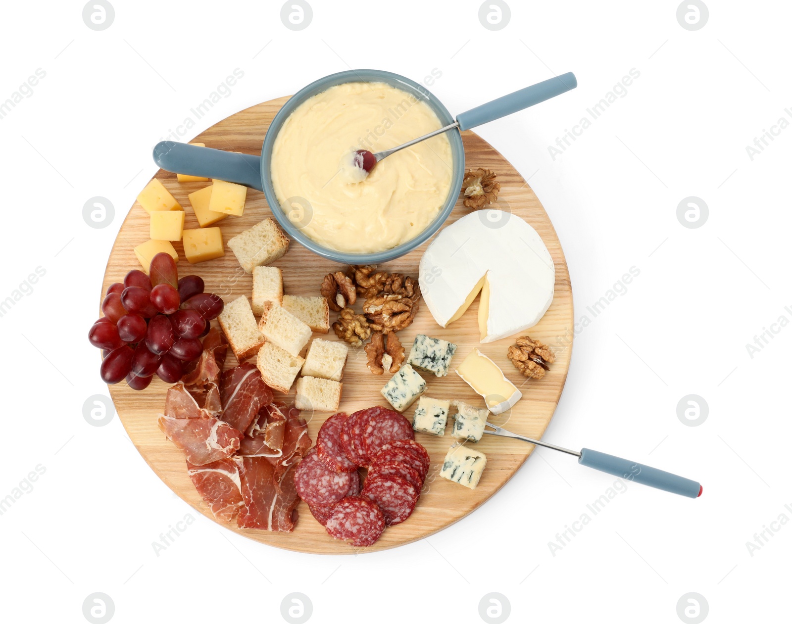 Photo of Fondue with tasty melted cheese, forks and different snacks isolated on white, top view