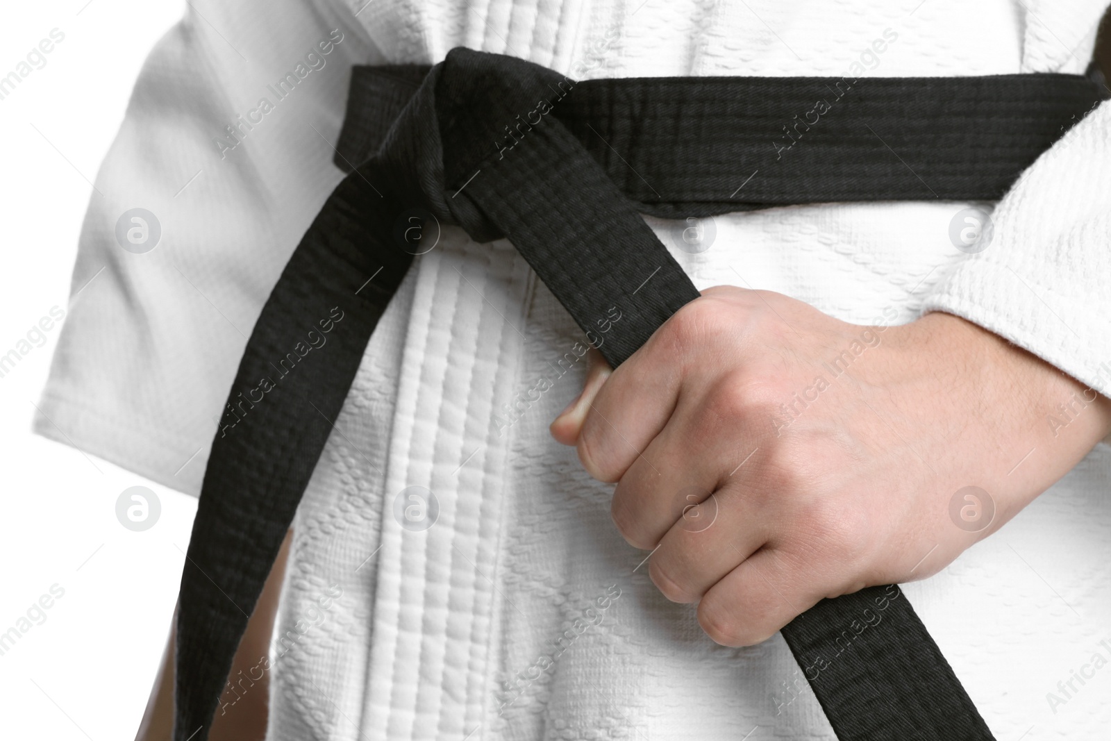 Photo of Karate coach wearing kimono and black belt on white background, closeup