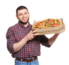 Attractive young man with delicious pizza on white background