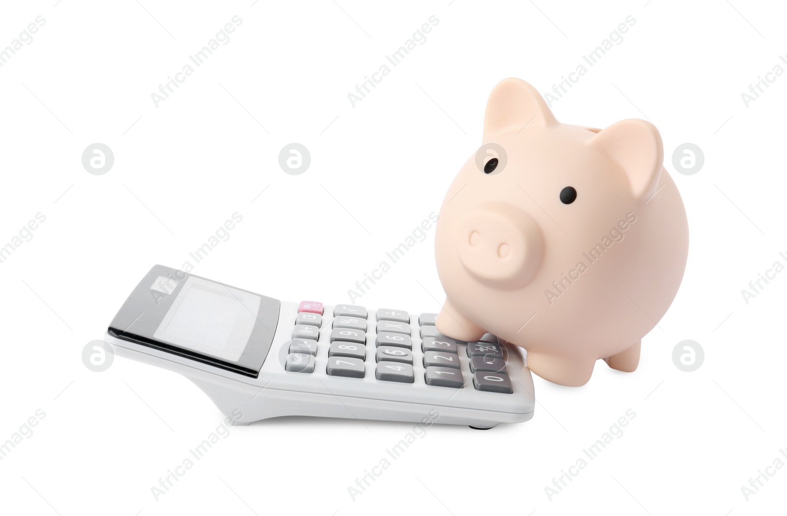 Photo of Calculator and piggy bank isolated on white