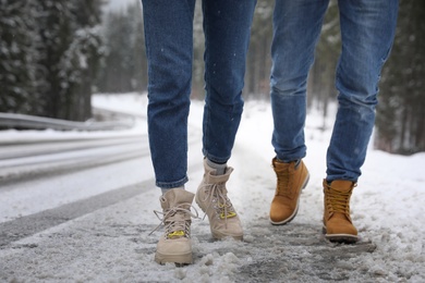 People walking outdoors on snowy winter day