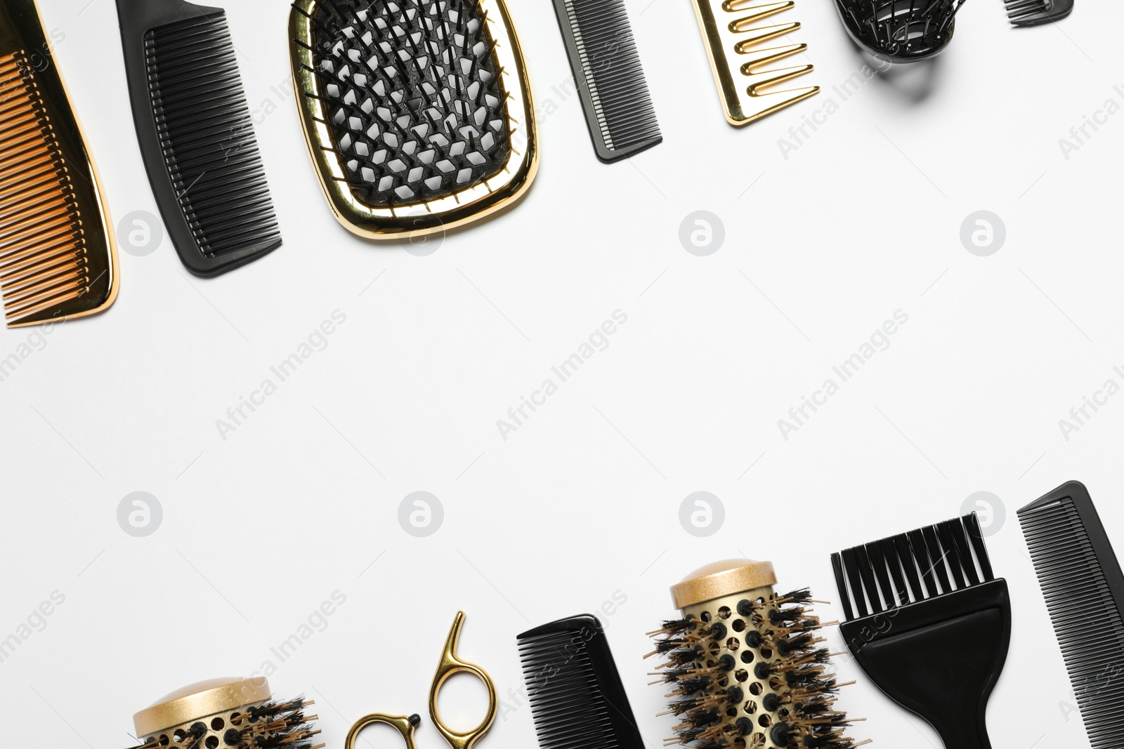 Photo of Hairdressing tools on white background, flat lay. Space for text