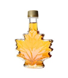 Photo of Leaf shaped bottle of delicious maple syrup isolated on white