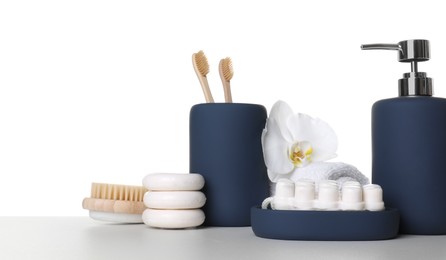 Bath accessories. Different personal care products and flower on table against white background. Space for text